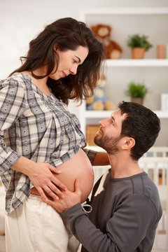 Portrait of pregnant couple expecting baby