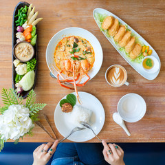 Young people eating in a Thai restaurant