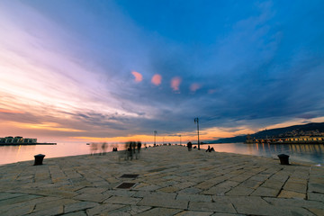 Obraz premium Colorful sunset in front of the city of Trieste