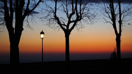 Bergamo, the old city. The old walls. Lombardy, Italy. Silhouette of light pole during the sunset