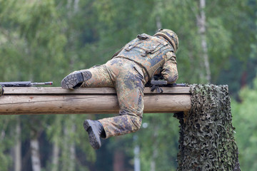 a german soldier trained on assault course - obrazy, fototapety, plakaty