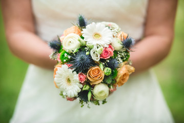 Obraz na płótnie Canvas Beautiful Wedding Bouquet In Bride's Hands