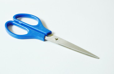 scissor with blue handle on white background 