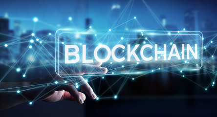 Businessman using blockchain cryptocurrency interface 3D rendering