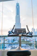 close-up, exercise bike with city view in window