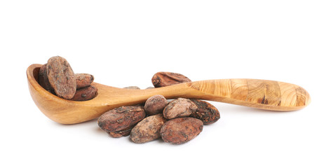 Wooden spoon of cocoa beans isolated