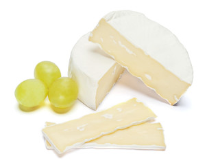 Piece of brie or camambert cheese on a white background - obrazy, fototapety, plakaty