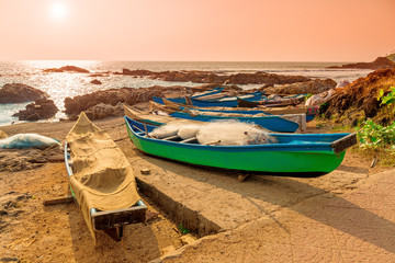 fishing boats with nets by the ocean. Tinted.