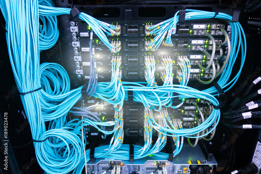 Poster fibre channel swich. fibre channel swich. server rack audio cable. severs computer in a rack at the 