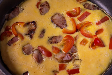 Scrambled eggs with ham and vegetables