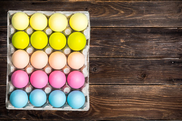 Vibrant Easter Eggs on wooden background