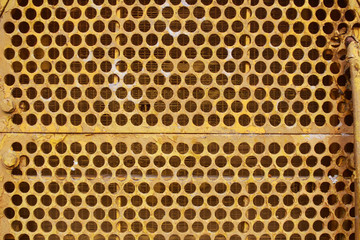 Close up yellow tractor front grille