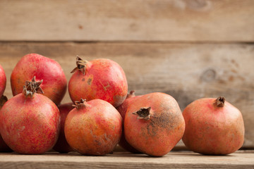 Fototapeta na wymiar pomegranates on a wooden counter