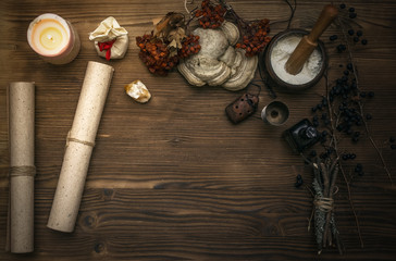 Ancient magic scroll on wooden desk table. Witchcraft. Witch doctor desk table. Magic potion....