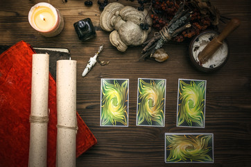 Tarot cards on fortune teller desk table. Witch doctor. Witchcraft. Magic herbal collection.