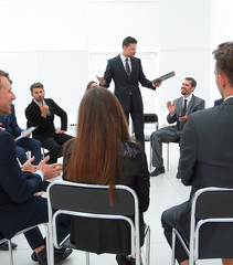 coach leads the session with the business team.