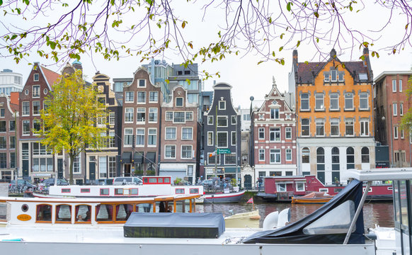 Traditional old buildings and boats in Amsterdam, Netherlands