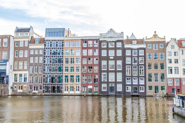 Naklejka premium Traditional old buildings in Amsterdam, Netherlands