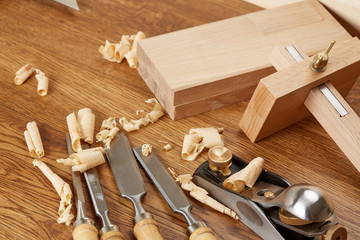 DIY concept. Woodworking and crafts tools. Carpentry hand tools. Planers, chisels, measuring tools. Wooden background.