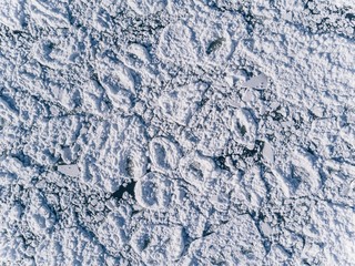 Aerial view over the surface of sea and cracked ice