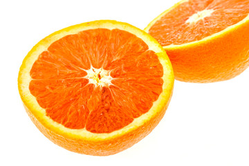 Close up of fresh sunkist orange isolated on white background