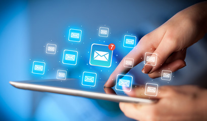 Fingers touching tablet with mail