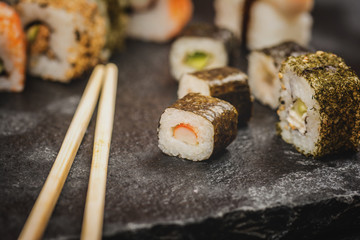 Sushi rolls hosomaki and uramaki