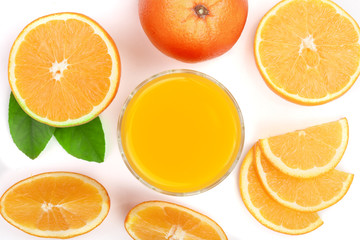orange juice glass with slices of citrus and green leaves isolated on white background, top view. Flat lay pattern