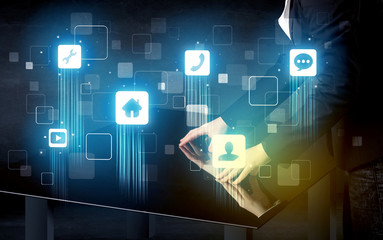 Modern smart table with high tech icons on its interface screen