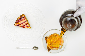 Transparent teapot, glass cup, spoon