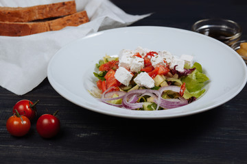 Close up of tatsy greek salad with fresh vegetables