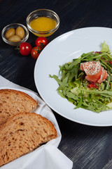 Close up of tasty salad with salmon