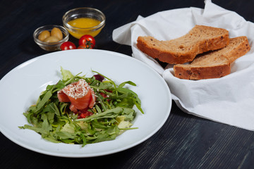 Close up of tasty salad with salmon and vegetables