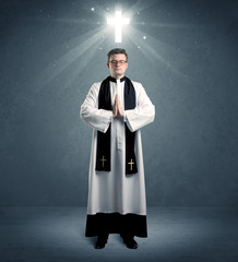 young priest in giving his blessing