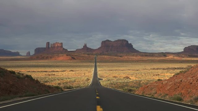 morning shot of hwy 163 with no cars at monument valley in utah, usa