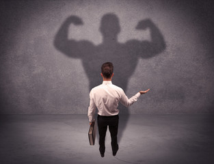 Successful businessman with strong shadow