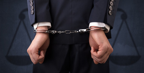 Arrested man with balance on the background