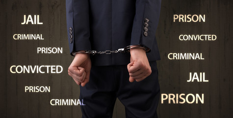 Close convicted with labels and handcuffs