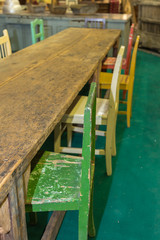 Wooden Table Top and Colorful Vintage Chairs Indoor
