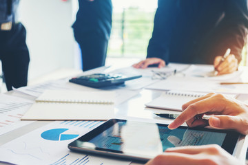 Business team meeting working on digital tablet new business project