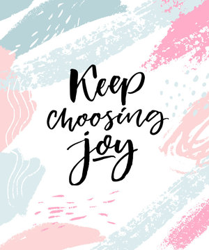 Keep choosing joy. Positive inspirational quote. Brush calligraphy on pink and blue pastel strokes.