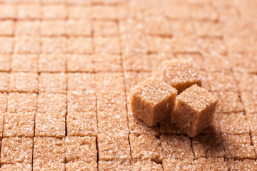 Accurately evenly folded brown cane sugar in cubes