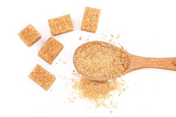 brown sugar in wooden spoon isolated on white background. Top view. Flat lay