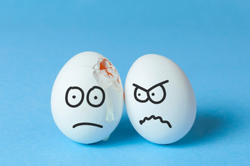 Drawing bodily injuries, fighting, finding out the relationship. Egg with a frustrated face because of a crack in the co-shell and an egg with an evil face
