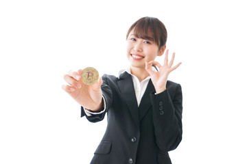 ビットコイン・仮想通貨を持つ女性