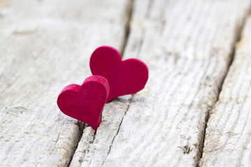 Naklejka na ściany i meble red hearts on wooden background