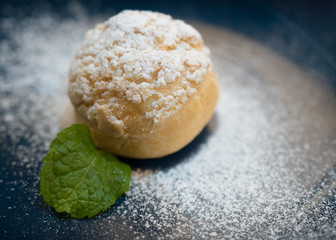 Snack and Dessert, Homemade Choux Cream or Choux Dough Stuffed With Custard Cream, dessert on blue plate, Selective focus