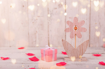 Flowers composition for Valentine's, Mother's or Women's Day. Pink flowers on old white wooden background.