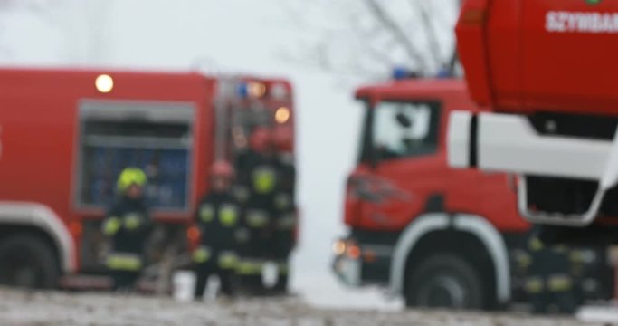 Firefighter or fireman fiting with fire on home.
