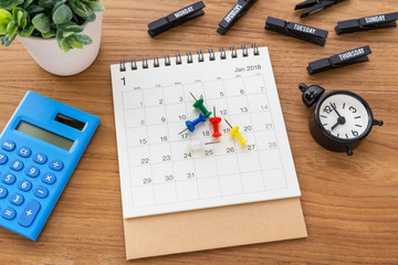 Calendar with pins and clock